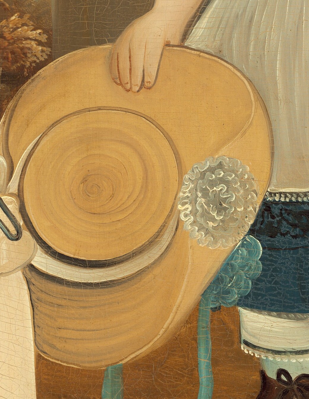 This straw hat could represent summer days and outdoor play.