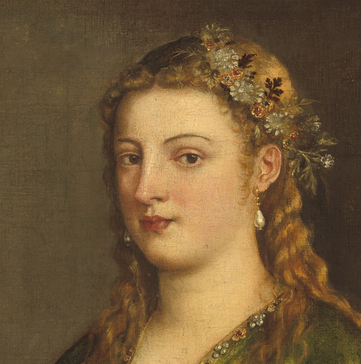 Titian gives her calm, averted eyes and a face built from soft light.