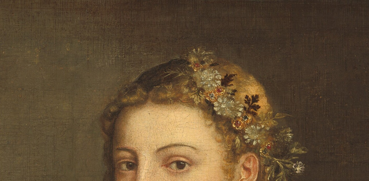 Her gold hairnet and embroidered trim are pure aristocratic display.