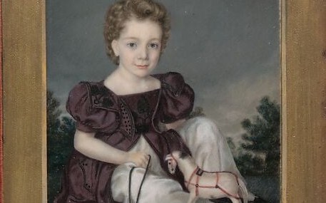 Children of this era were dressed as miniature adults for formal portraits; the sober color and cut encode the family's aspirations more loudly than the child's own identity.