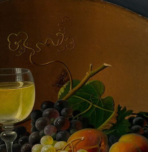 Same grapes, same peach, same wine glass.