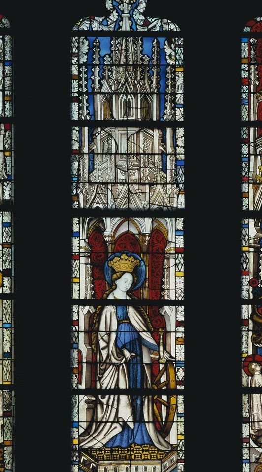 The Virgin Mary in white, crowned Queen of Heaven.