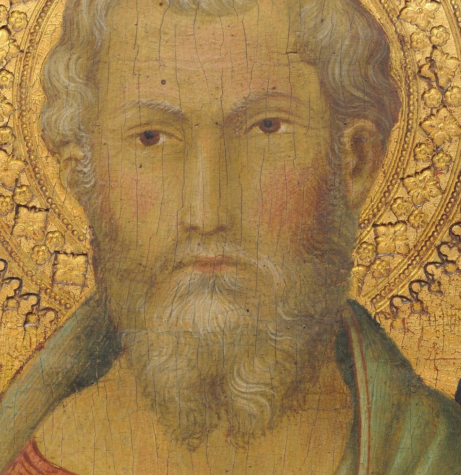 His long beard and serene face suggest wisdom and age.