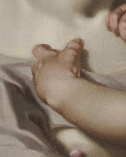 The tender way her hands hold the baby highlights the physical act of care and protection.