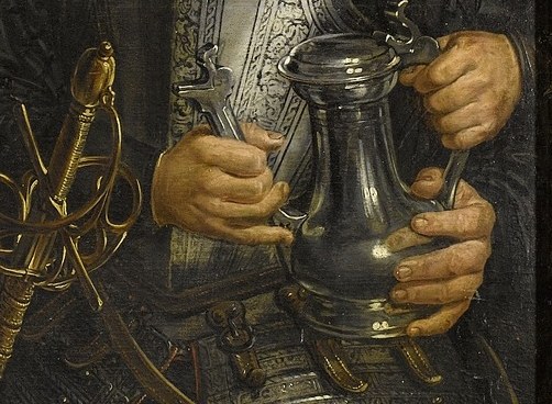 See the silver ewer and the plate of green olives?