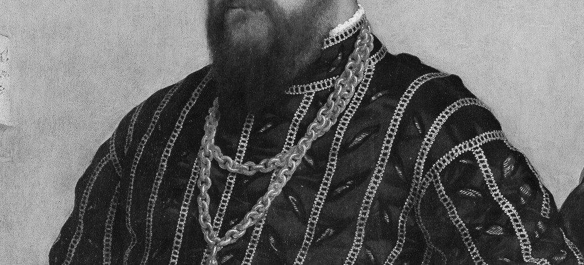 His gold chain signals a nobleman or a knight.