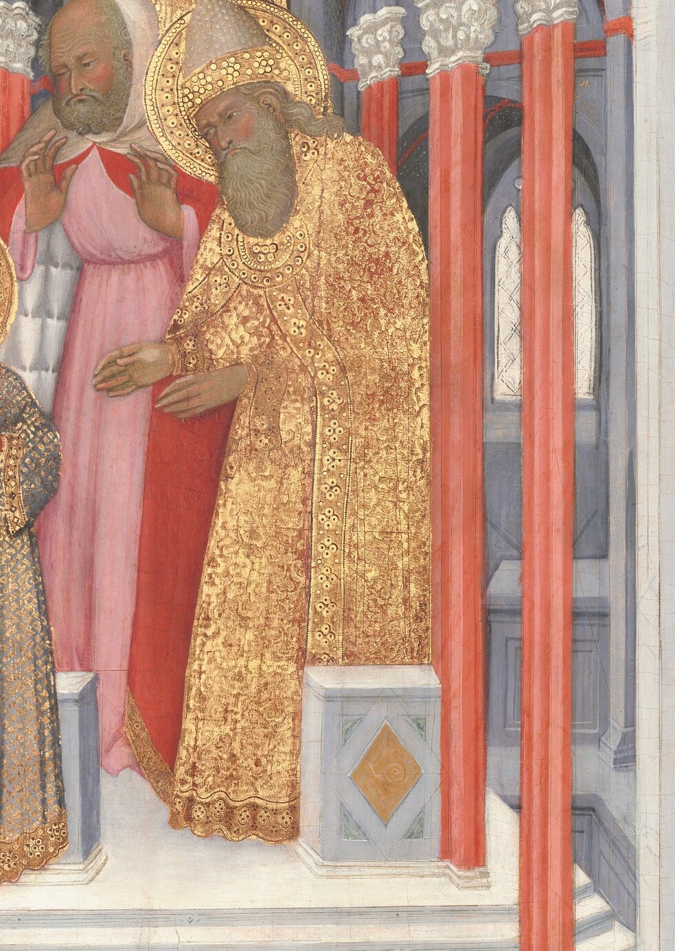His ornate garment and gesture indicate his significant role in the ceremony.