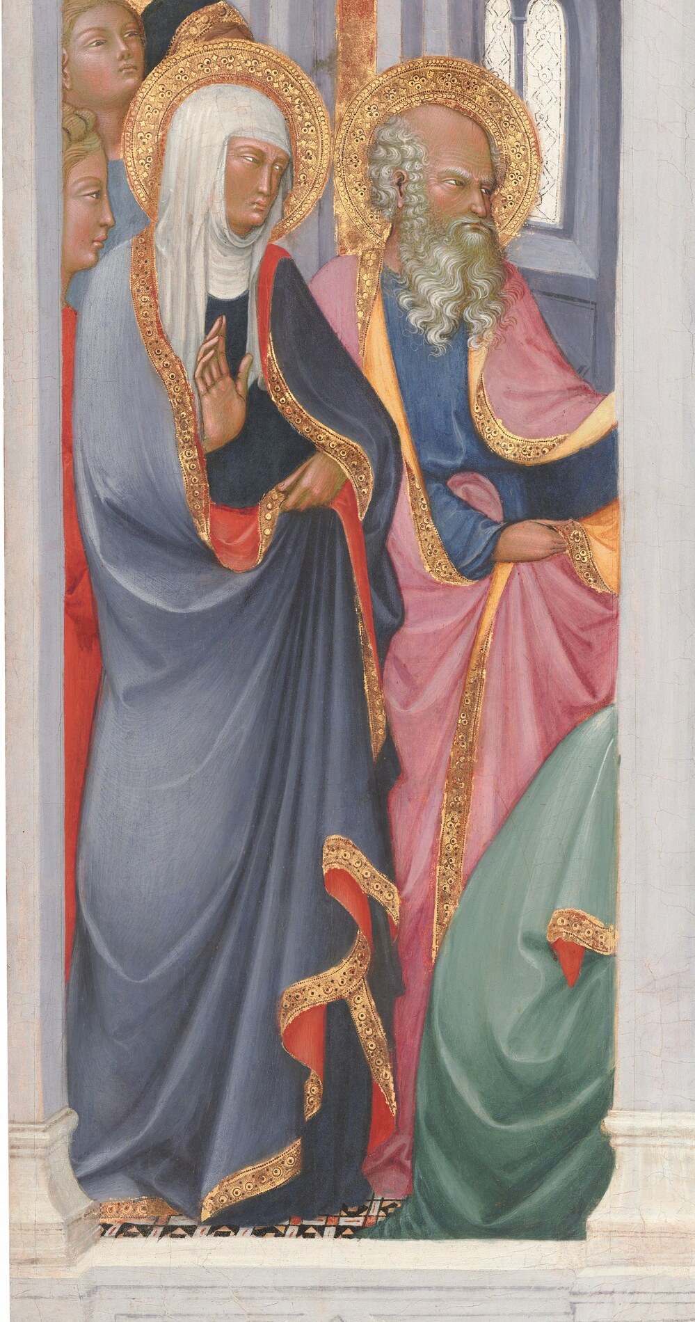 Her aged appearance and protective gesture suggest she is a guardian or parent.