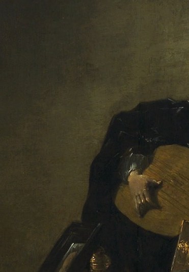 This man plays a lute, lost in song.