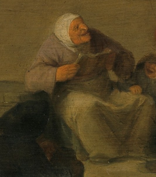 Here, a woman reads aloud from a small song book.