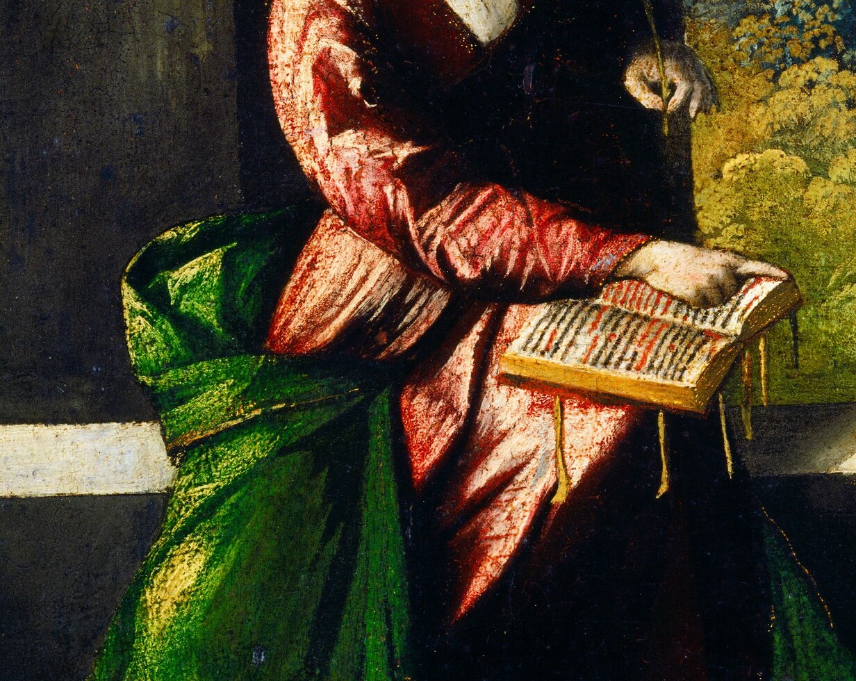 Attribute of learning or devotion; the visible pages invite a viewer to wonder whether text is legible , a natural close-up target.