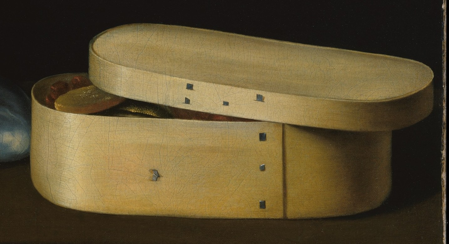The simple chip-wood box contrasts with the exotic shells.