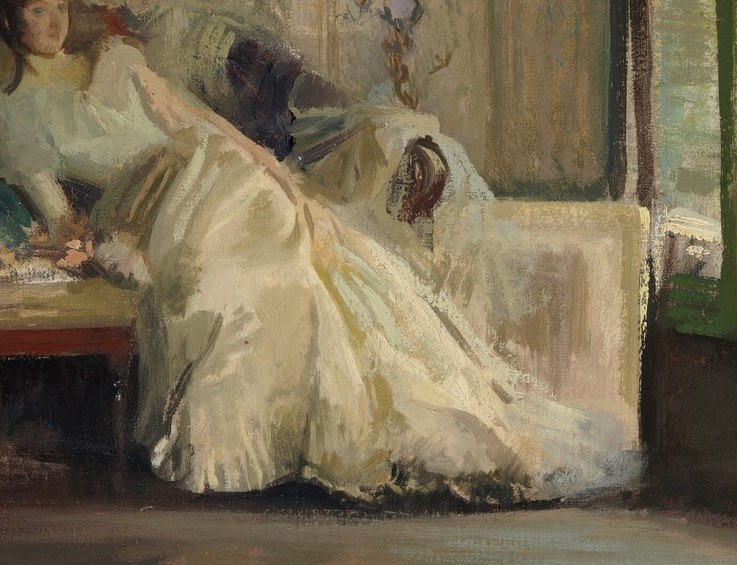 Her white dress catches the soft light.