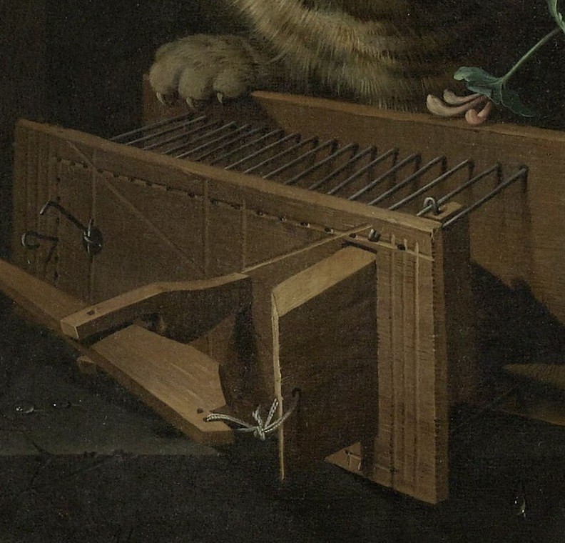And next to it, a wooden mouse trap, set.
