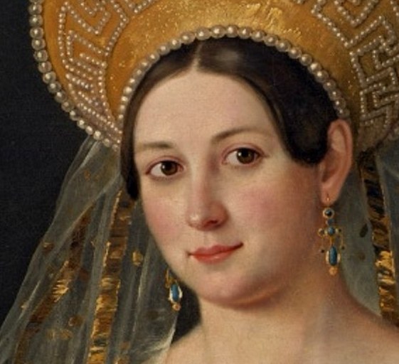 Her direct gaze and subtle smile convey a sense of quiet confidence and perhaps a hint of melancholy.