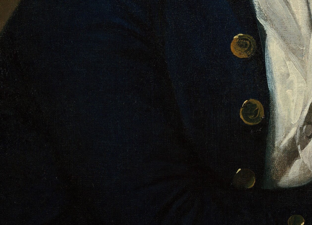 He's a merchant. The papers under his hand are ledgers.