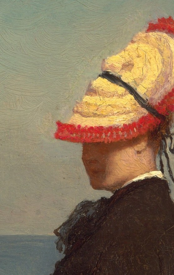 Her vibrant hat and handbag suggest her personal style.