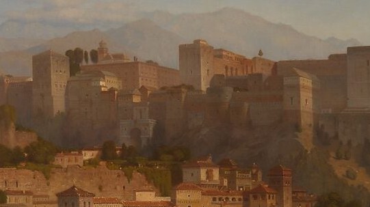 Densely packed vernacular architecture cascading down the slope captures the living city beneath the monument , warmly lit plaster contrasts with the fortress stone above
