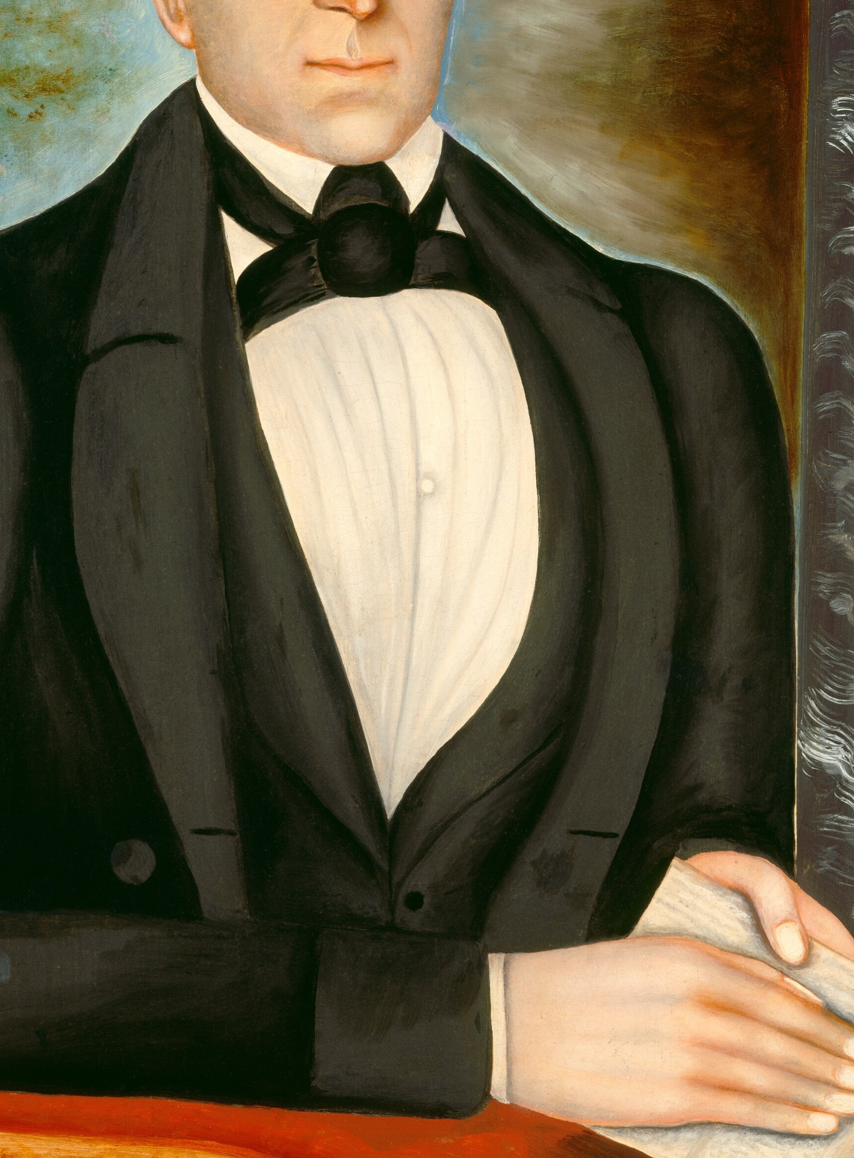 His pose is formal, with a black bow tie and dark suit jacket.