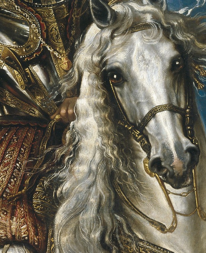 His ornate armor signals his military status.