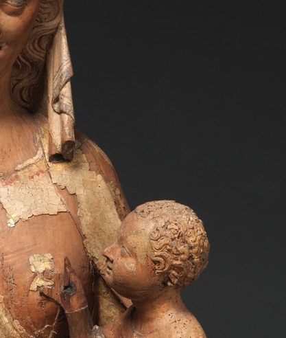 Under her hands, a child who survived the silence.