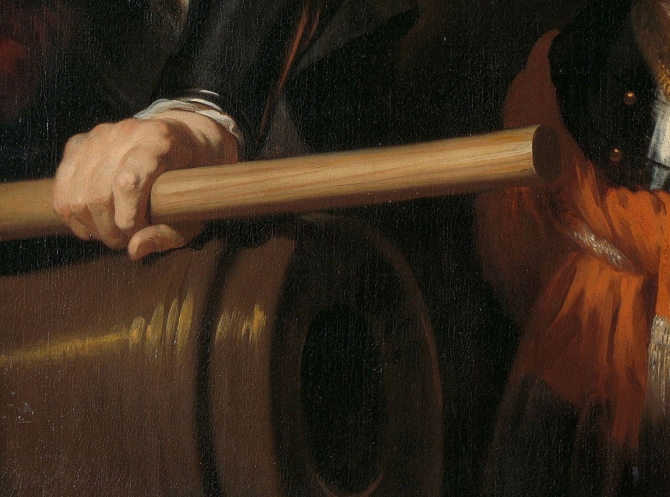 His command baton symbolizes his military leadership.