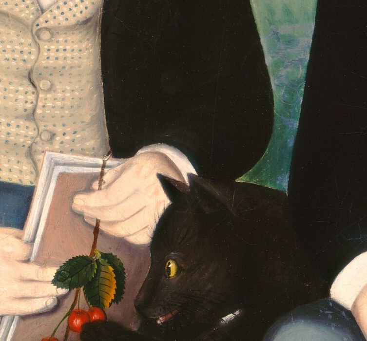 He delicately holds a book and a branch of red berries.