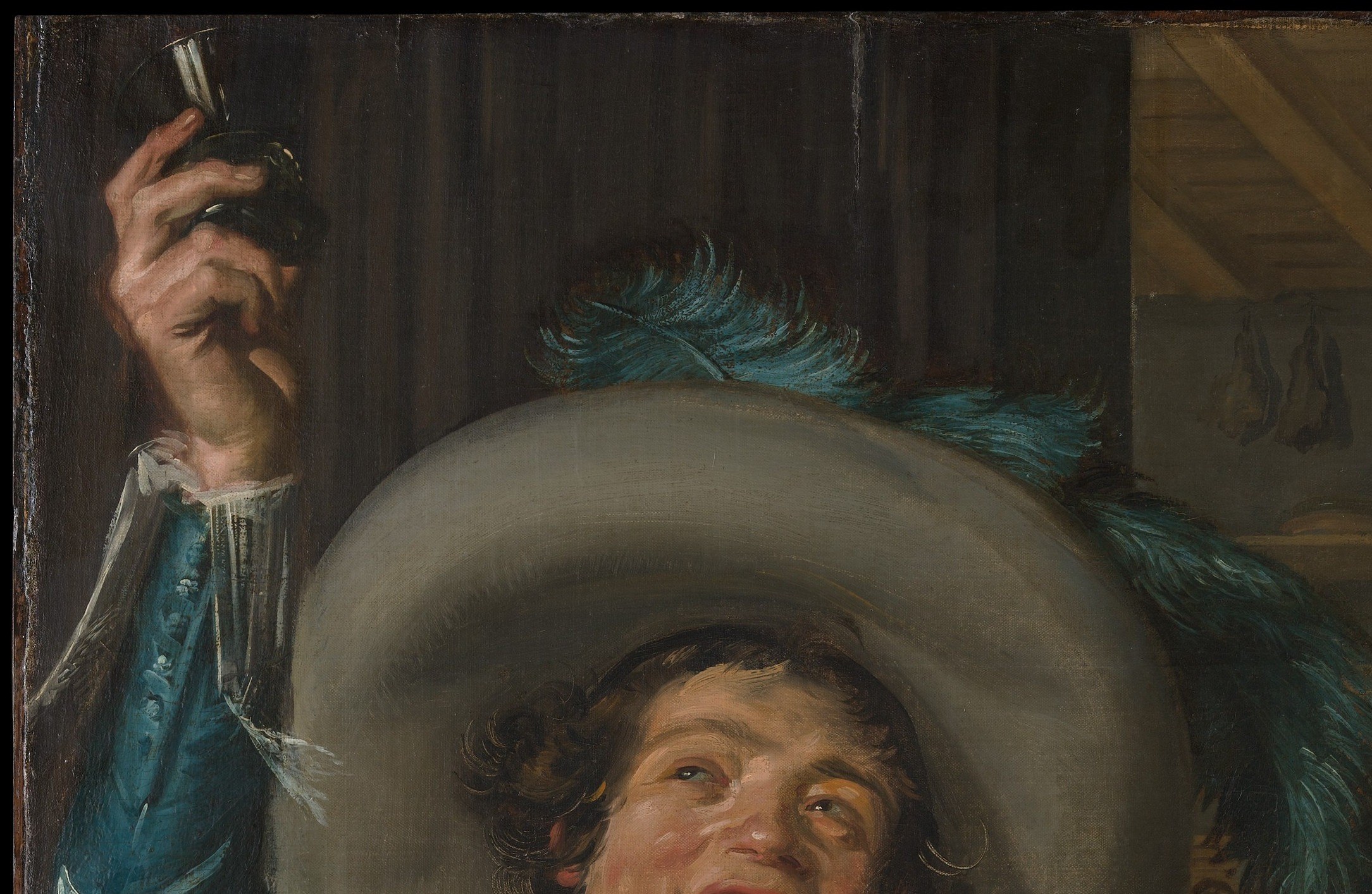 Its exaggerated width signals youthful fashionable swagger; it frames the entire upper composition and marks the wearer as a well-off young gentleman