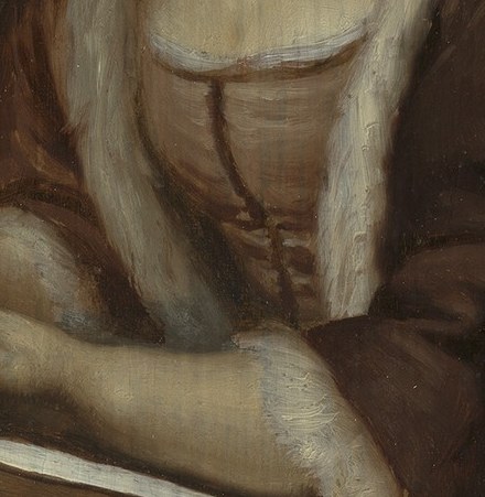 Her delicate feather quill is poised above the parchment.