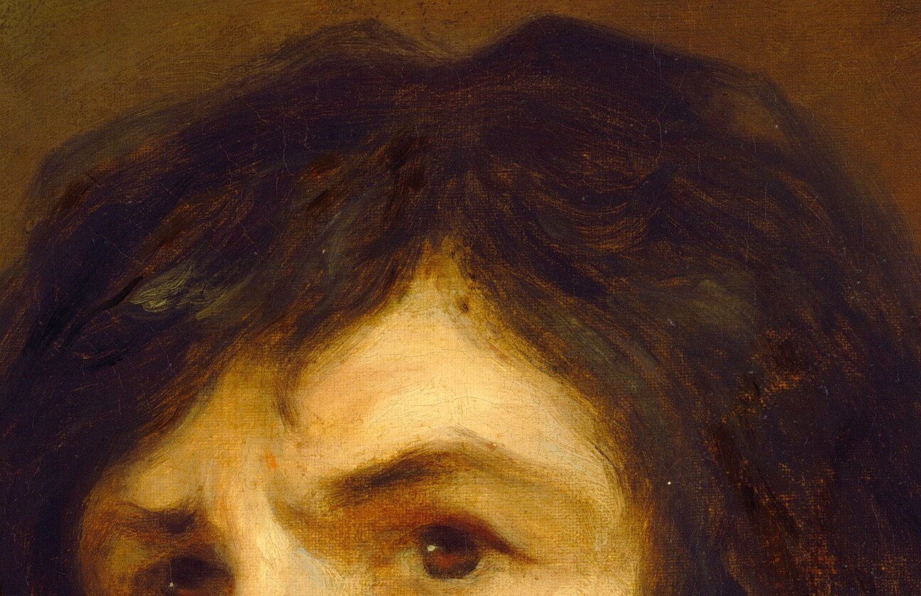 The tousled, dark hair adds a touch of informality and youthfulness to the portrait.