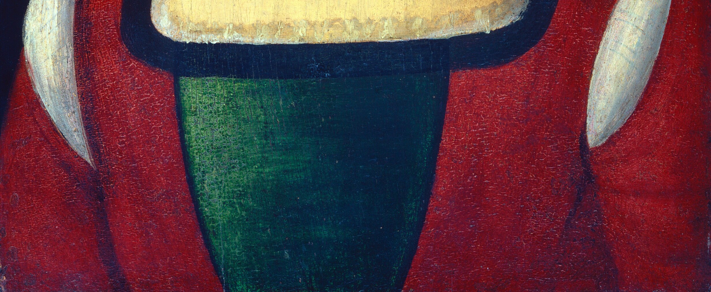 The rich color and texture of the fabric suggest status and wealth.