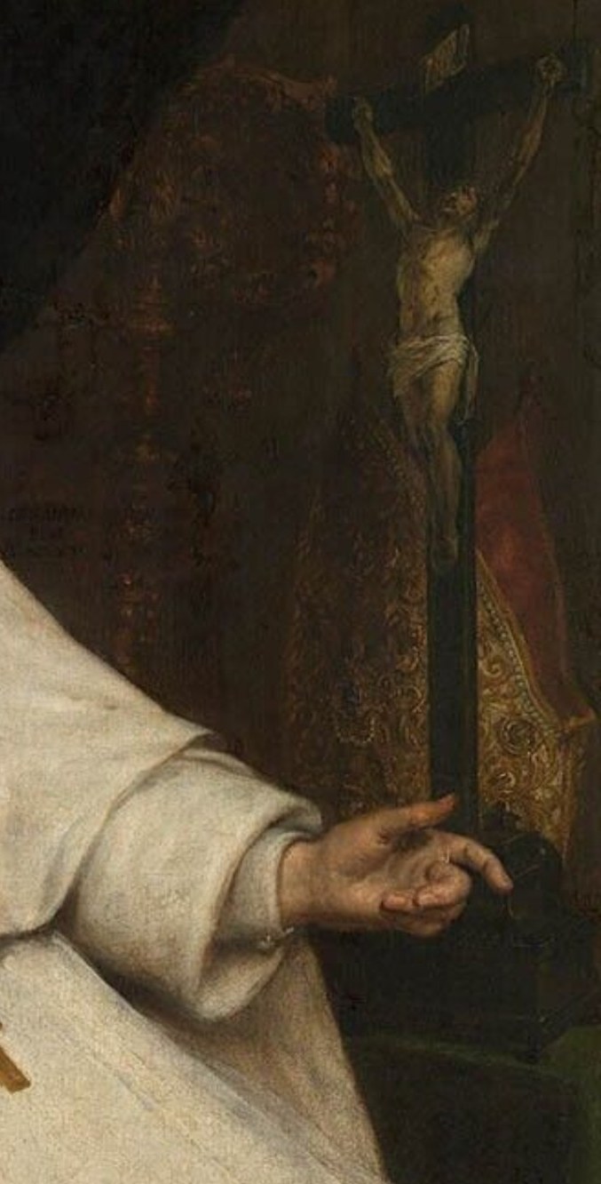 Behind him, a dimly lit crucifixion scene reminds us of sacrifice.
