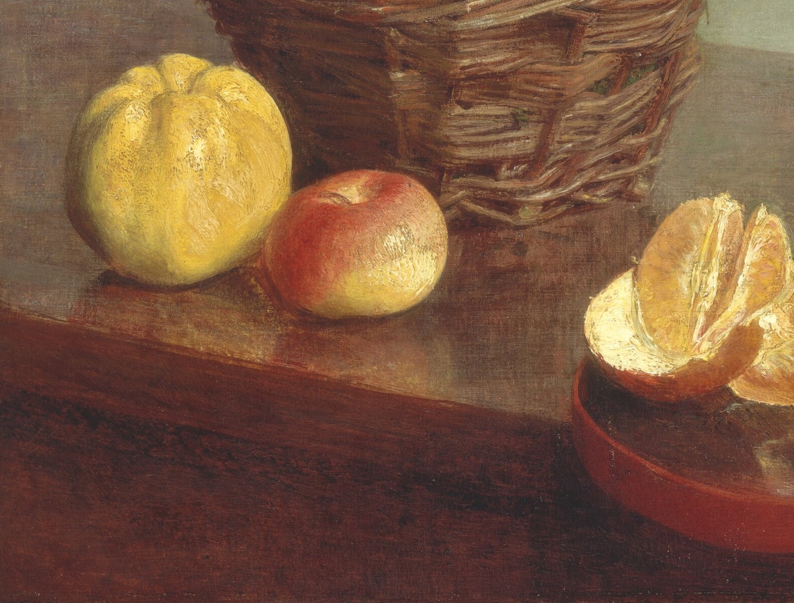 The cut orange exposes vivid flesh and implies a human presence , someone just peeled these , giving the scene a sense of interrupted time.