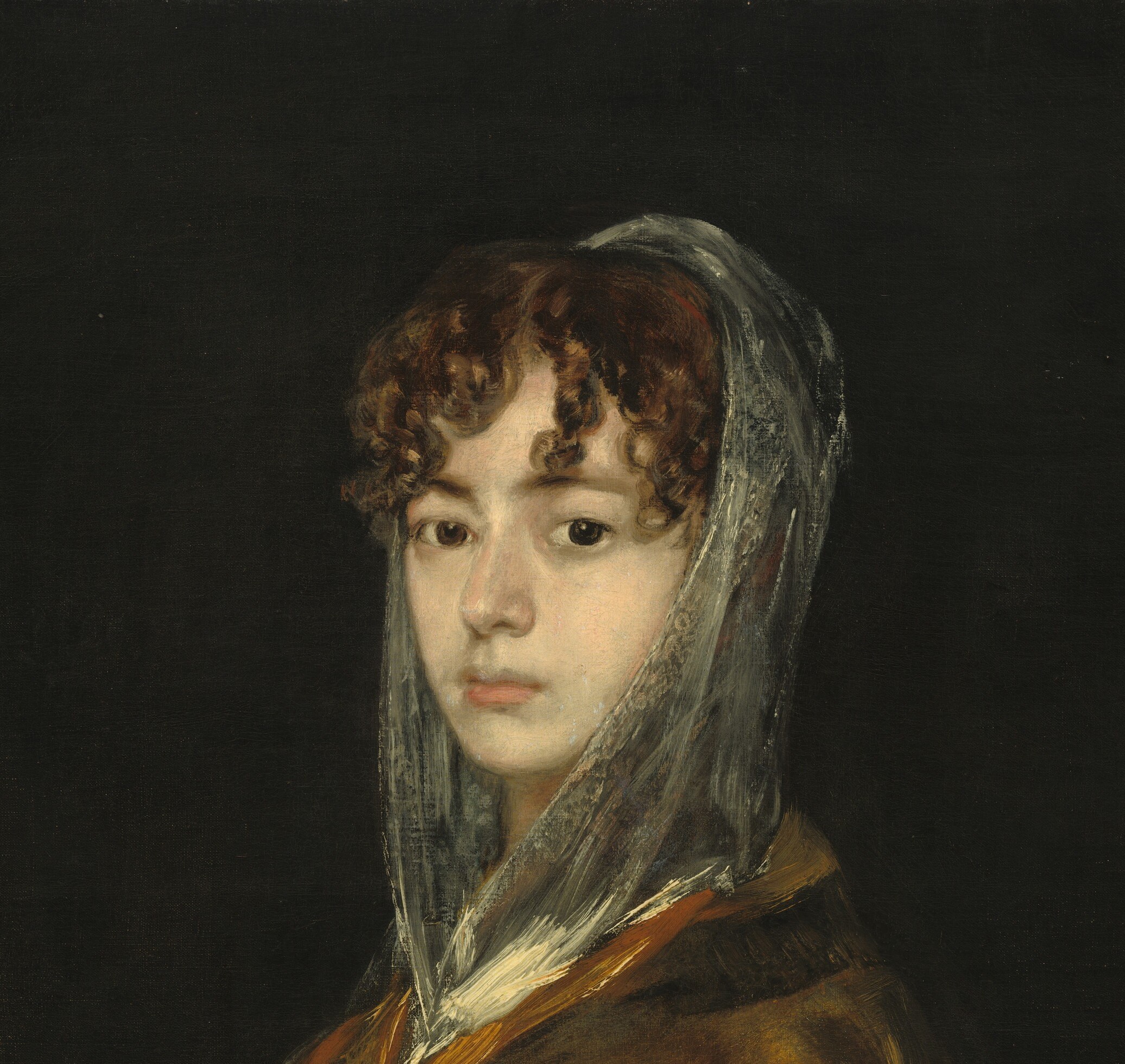 A key cultural emblem of Spanish femininity , the veil simultaneously reveals and conceals, and Goya's rendering of its translucency over dark hair is a technique showpiece