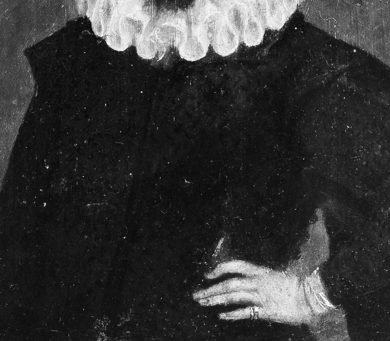 The dark, textured fabric contrasts with the white collar and draws attention to the sitter's face.