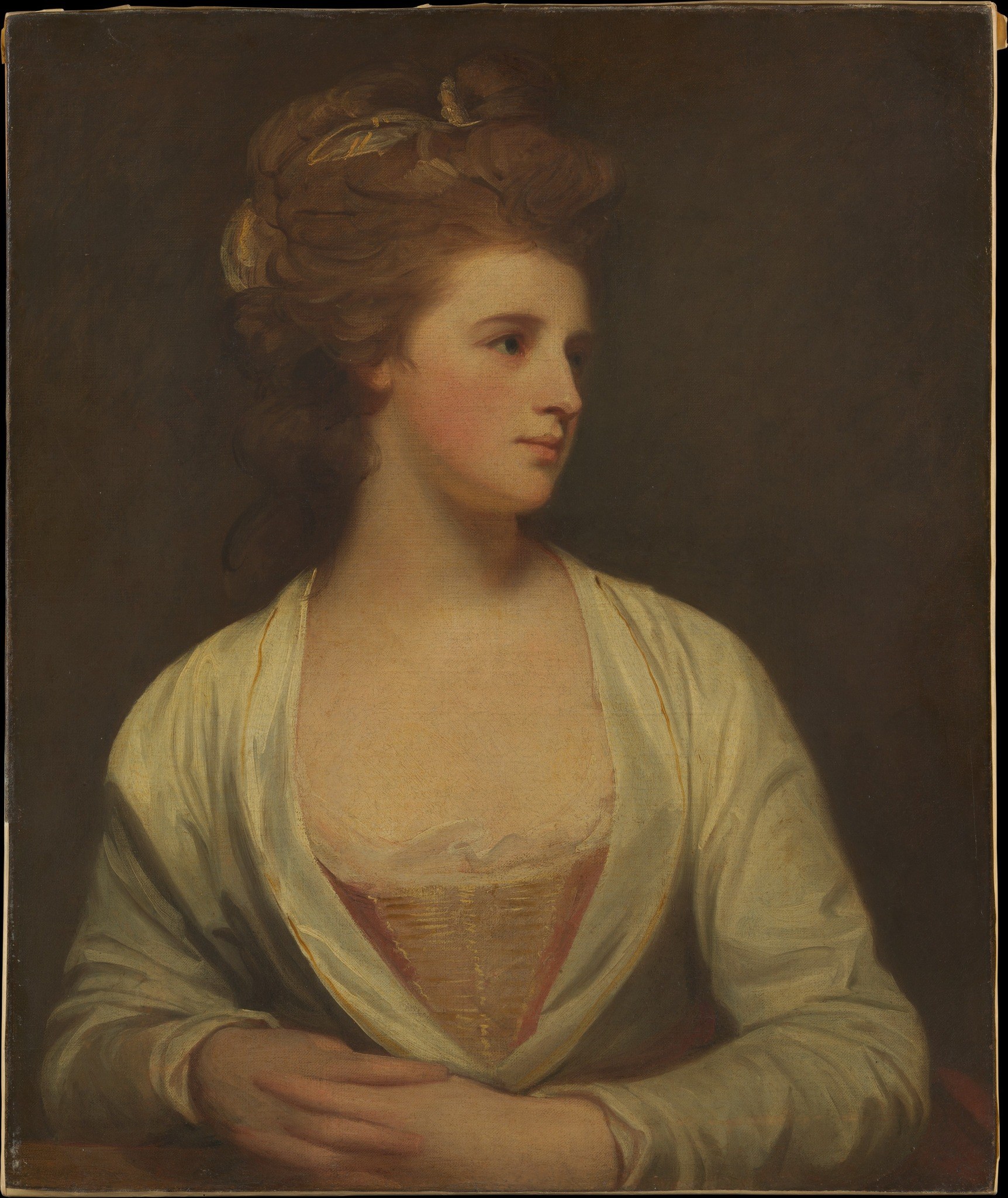 The deep, almost uniform shadow of the background isolates the sitter, emphasizing her presence and the intimacy of the portrait.