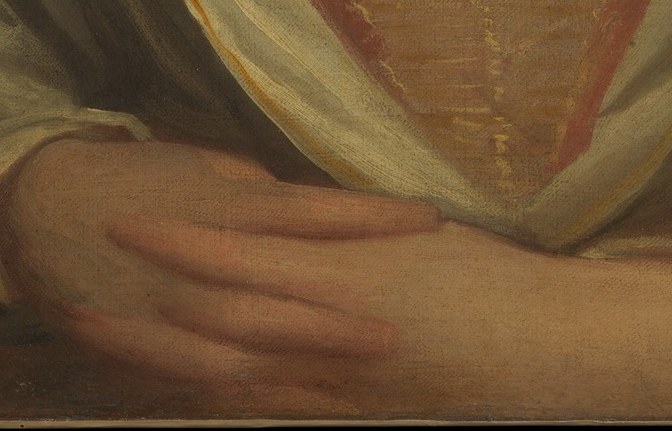 Her hands are relaxed, almost inviting.