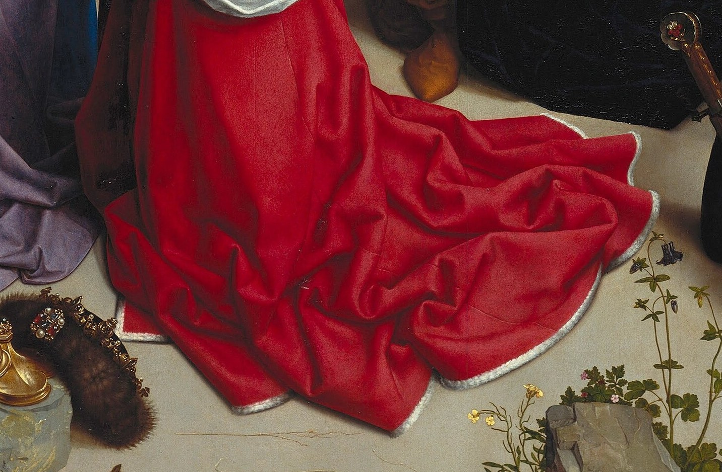 Look at the kneeling king's rich red robe.