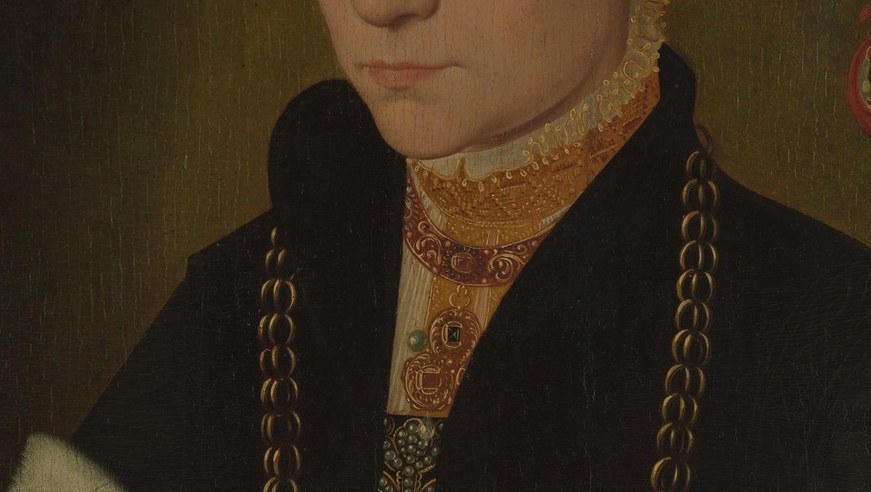 The gold chain around her neck is not just jewelry.