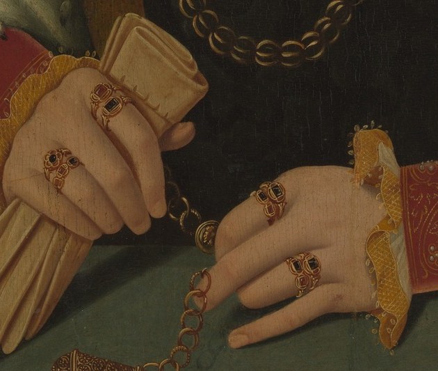 What she holds is a choice. A prayer book, or the household accounts.