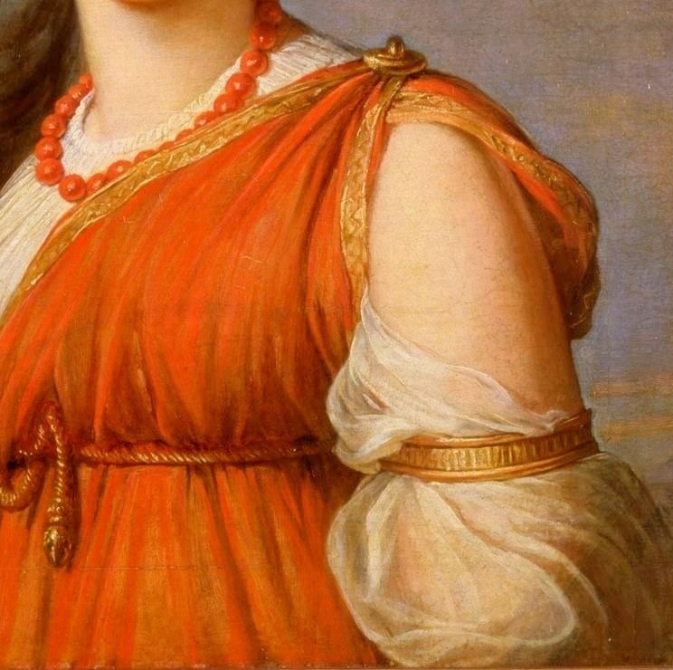 Look at the rich texture of her orange dress.