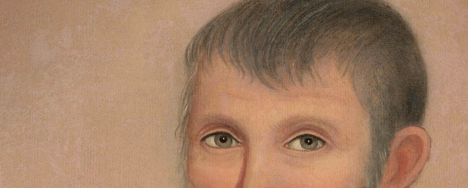 This man's intense gaze captures you.