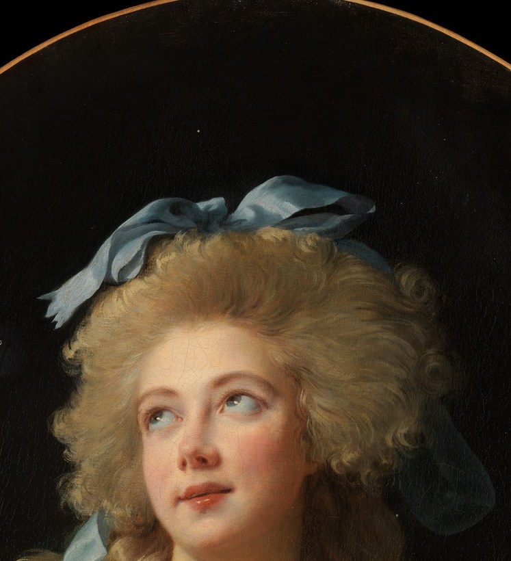 Her eyes lift slightly off-axis, giving a dreamy, distracted quality that made this face famous , she seems to look through the viewer rather than at them.