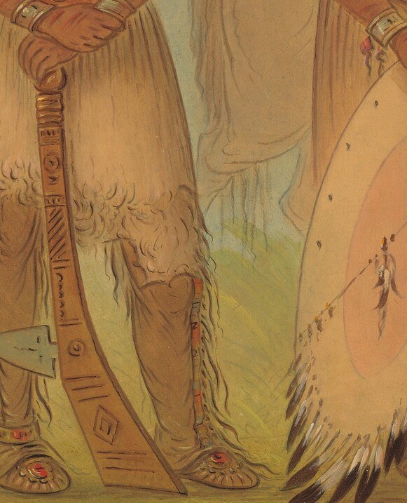 A circular shield with painted markings, a symbol of protection and warfare.