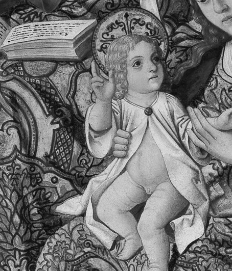 The infant reaches for the written Word.