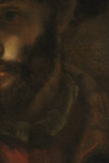 His face is hidden in deep shadow.