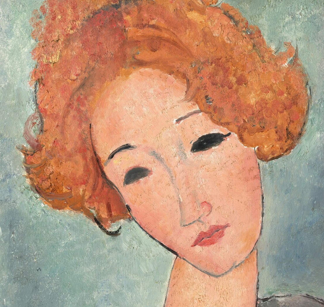 The vibrant red hair makes her stand out.