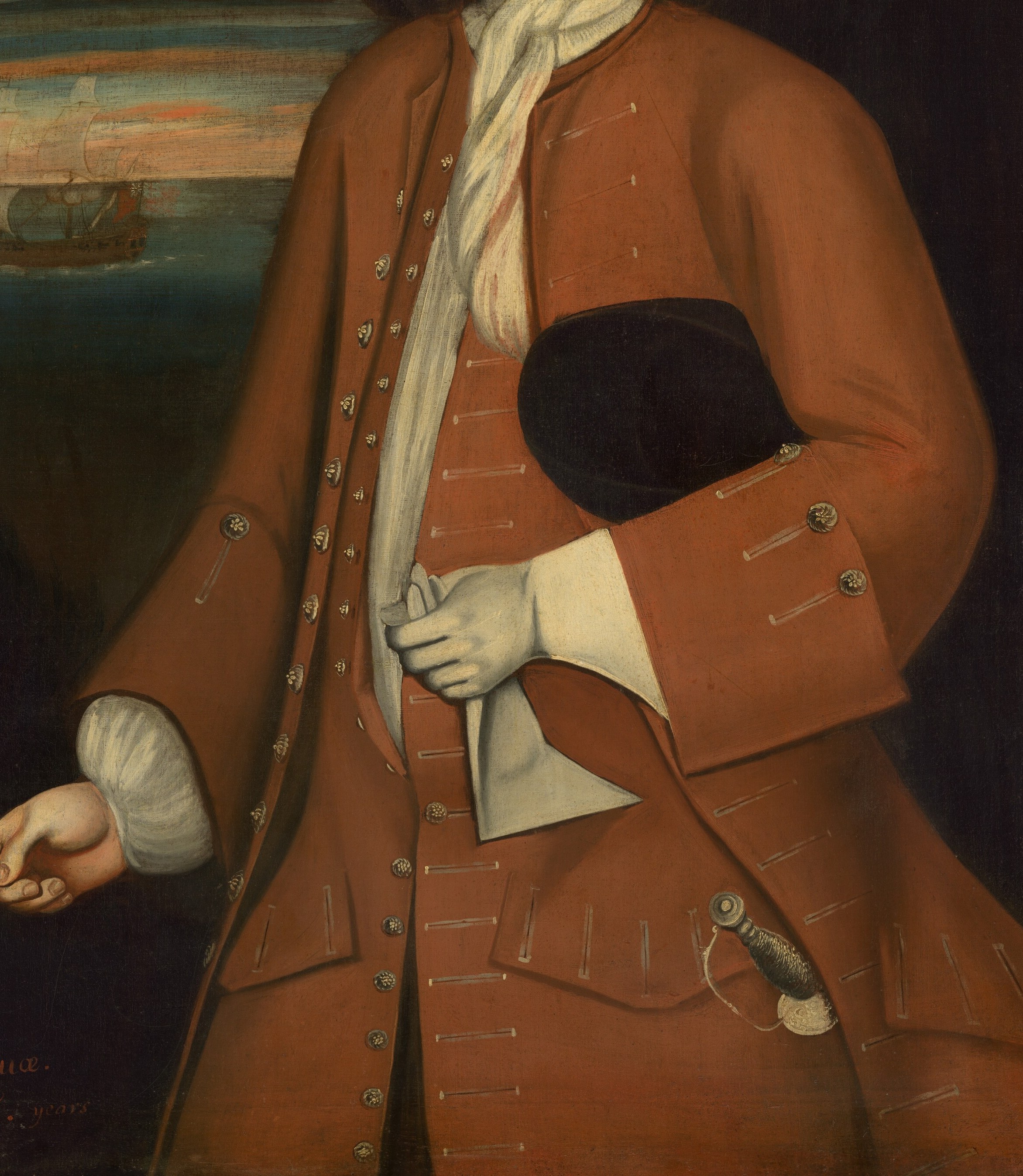 His red coat speaks of wealth and status.