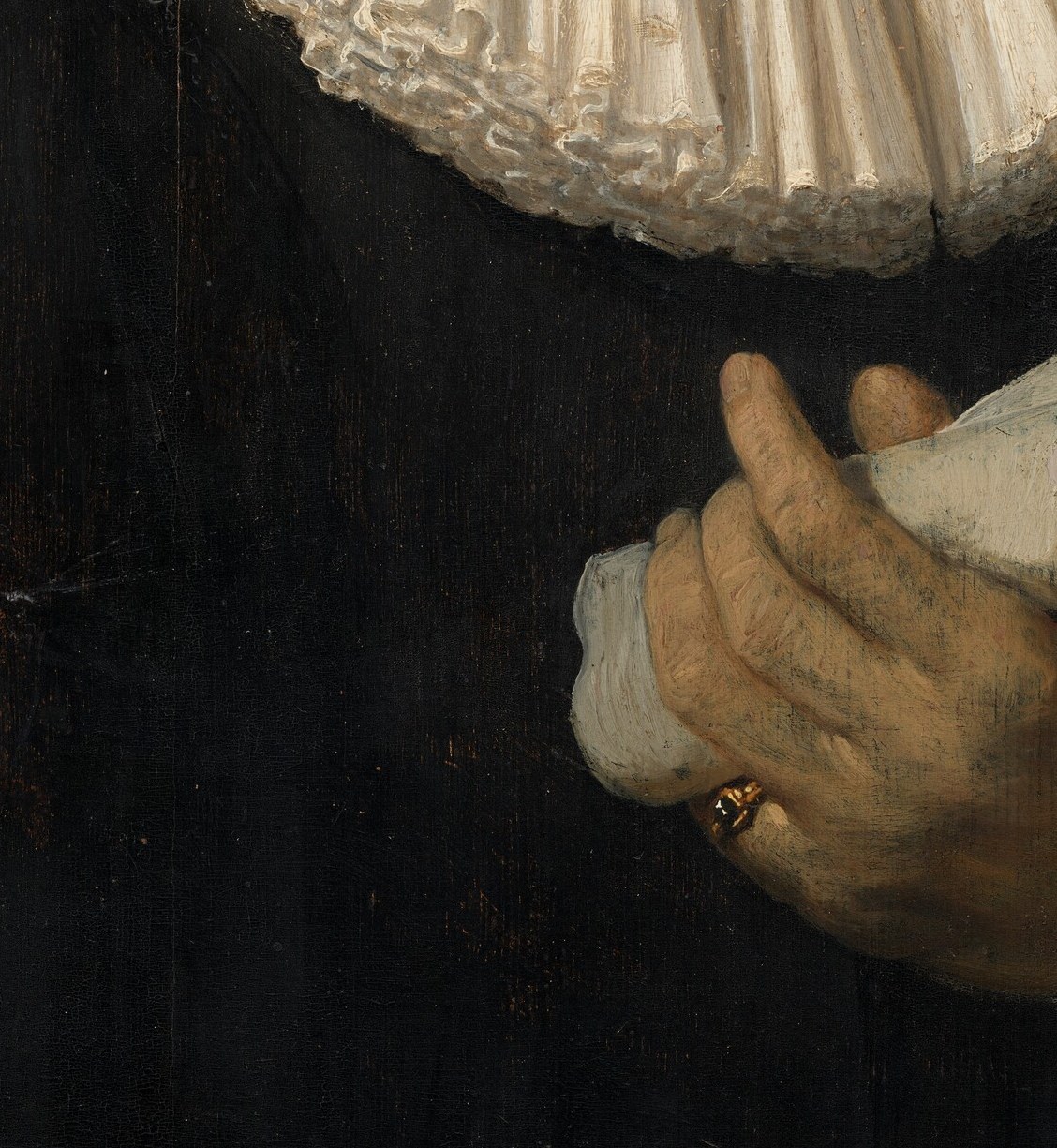 A sheet of music, rolled and held.