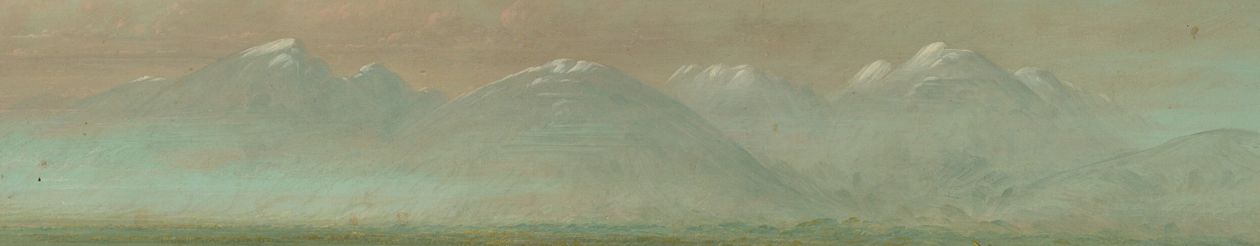The majestic mountains create a sense of depth and grandeur, defining the horizon.
